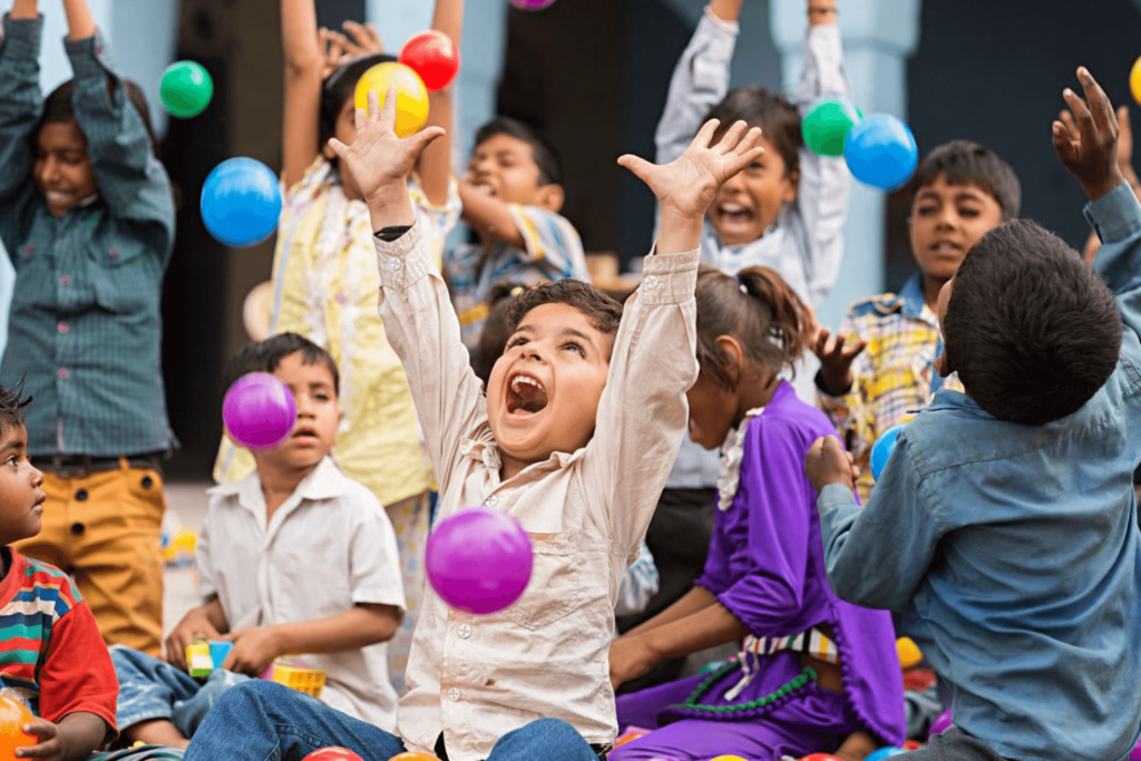 Children playing with colorful balls in group activity
