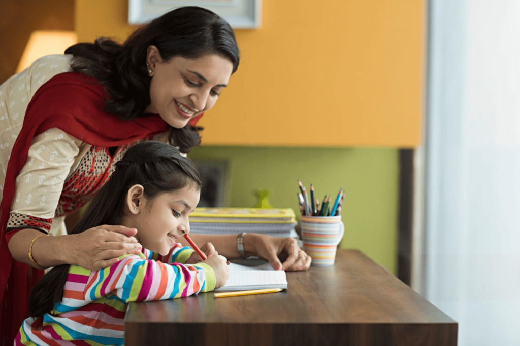 Teacher supporting girl with remedial training