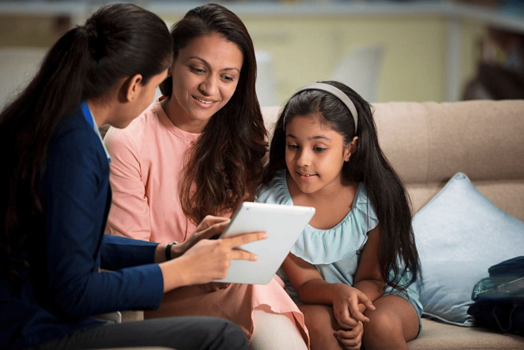 Therapist talking with girl during psychology session